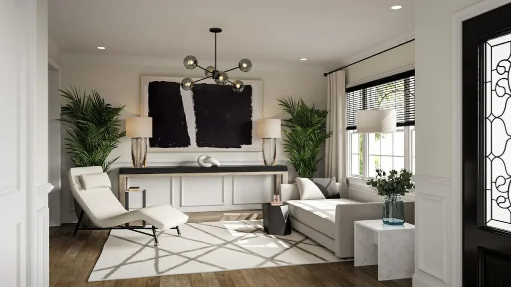 Modern living room featuring a sleek chaise lounge, L-shaped sofa, large black artwork, geometric rug, and potted plants for a cozy, high-end look