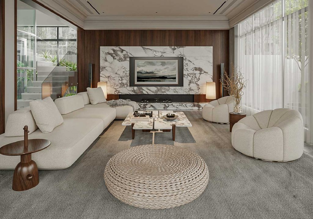 Modern living room interior with a neutral color palette featuring sculptural furniture, a luxurious marble wall with an integrated TV, elegant beige sofas, plush armchairs, a woven ottoman, and a pair of marble coffee tables, illuminated by warm lighting through sheer curtains.