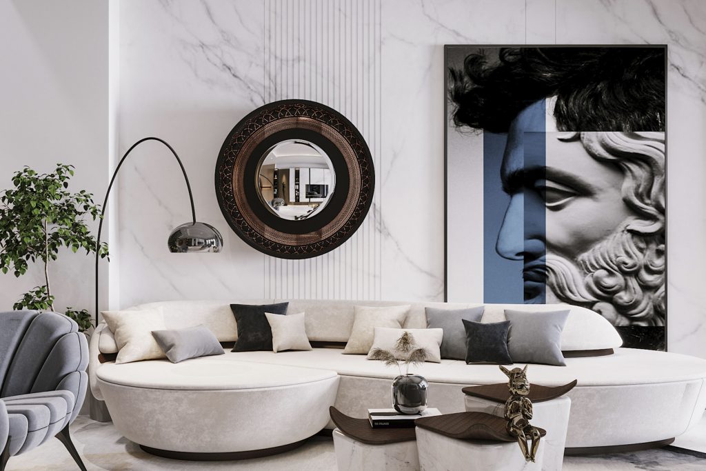 A luxurious modern living room featuring a round white sofa with layered cushions, a striking black circular mirror, a contemporary blue and white art piece, and sleek decor elements, blending heirlooms and modern accents to tell a story through design.
